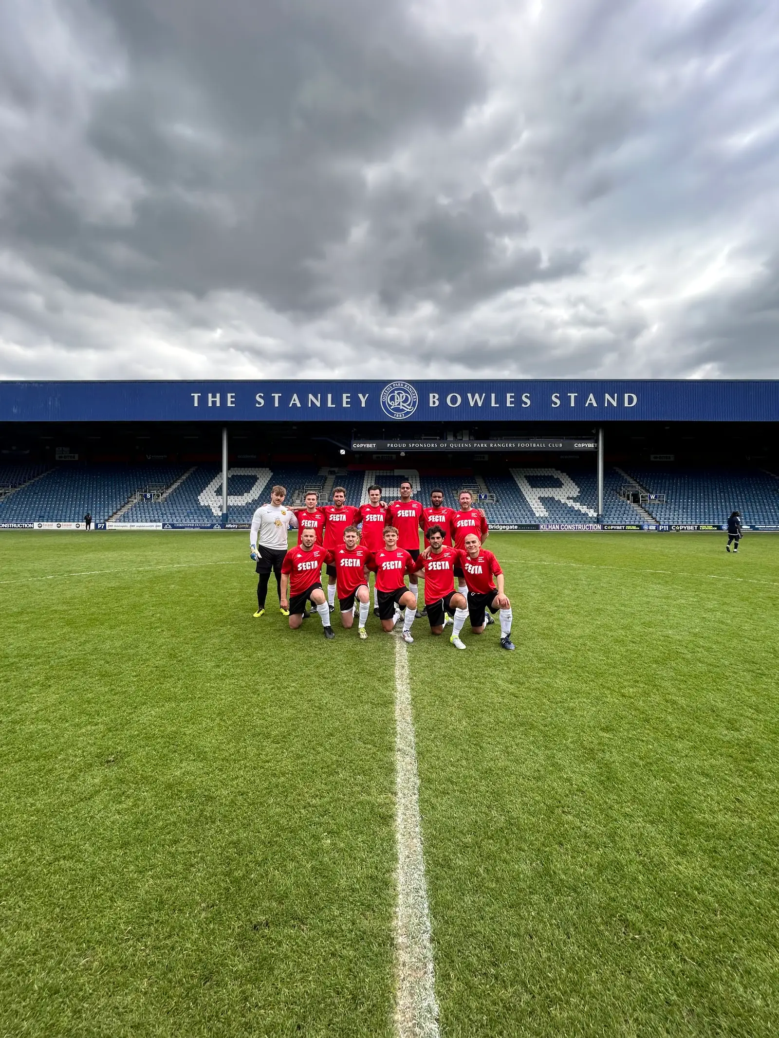 A company team posing for a squad photo at Secta's Property Cup in London.